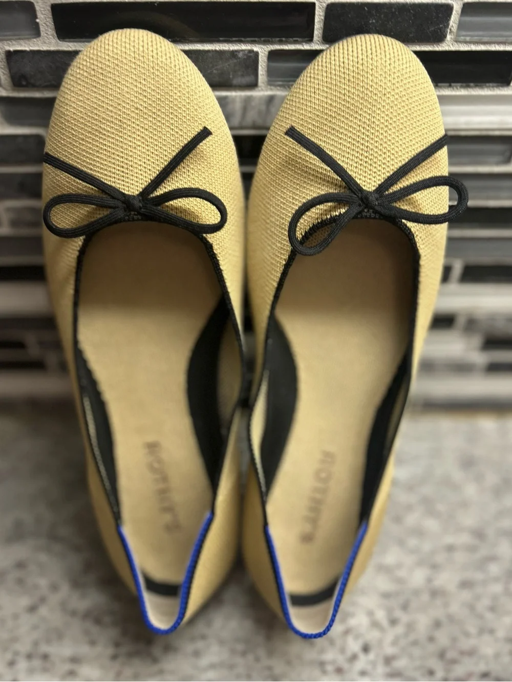 Rothy's Tan/cream Ballet Flats with Black Bow Trim and Blue Piping size 8